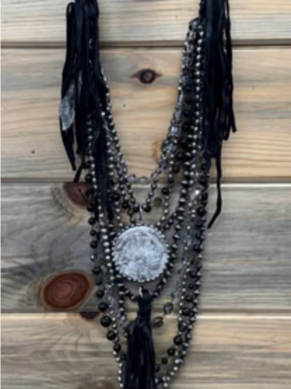 Black Multi-Strand Statement Necklace with Silver Medallion